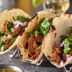 metal taco holder with three mexican carne asada street-tacos