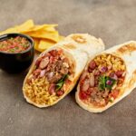 Traditional Mexican Beef Burrito with Nachos Chips and Salsa Sauce